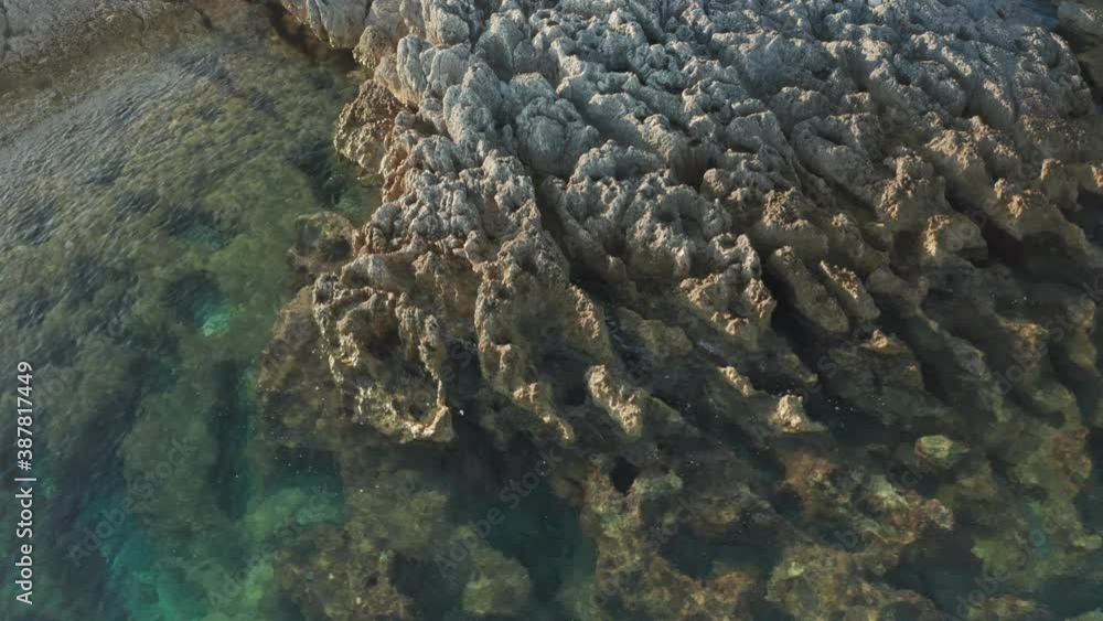 Parallax shot of a small reef on Cape Kamenjak, Croatia. Camera tilting up at the end of the shot. Parallax shot of a small reef on Cape Kamenjak, Croatia. Camera tilting up at the end of the shot.