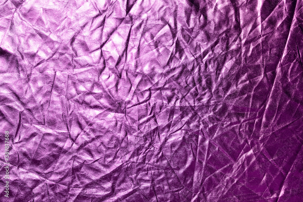 Purple crumpled metallic paper texture background. Abstract backdrop. Purple crumpled metallic paper texture background. Abstract backdrop.
