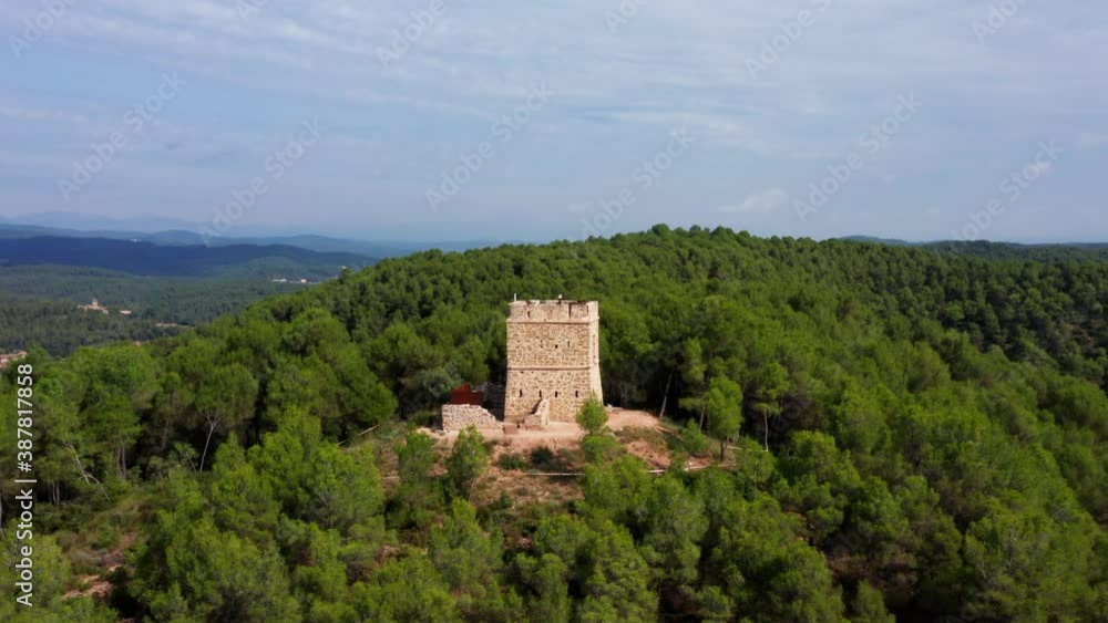 Beautiful historic European Stone watchtower in the middle of a dense beautiful Green forest surrounded by mountains, Drone Aerial Beautiful historic European Stone watchtower in the middle of a dense beautiful Green forest surrounded by mountains, Drone Aerial