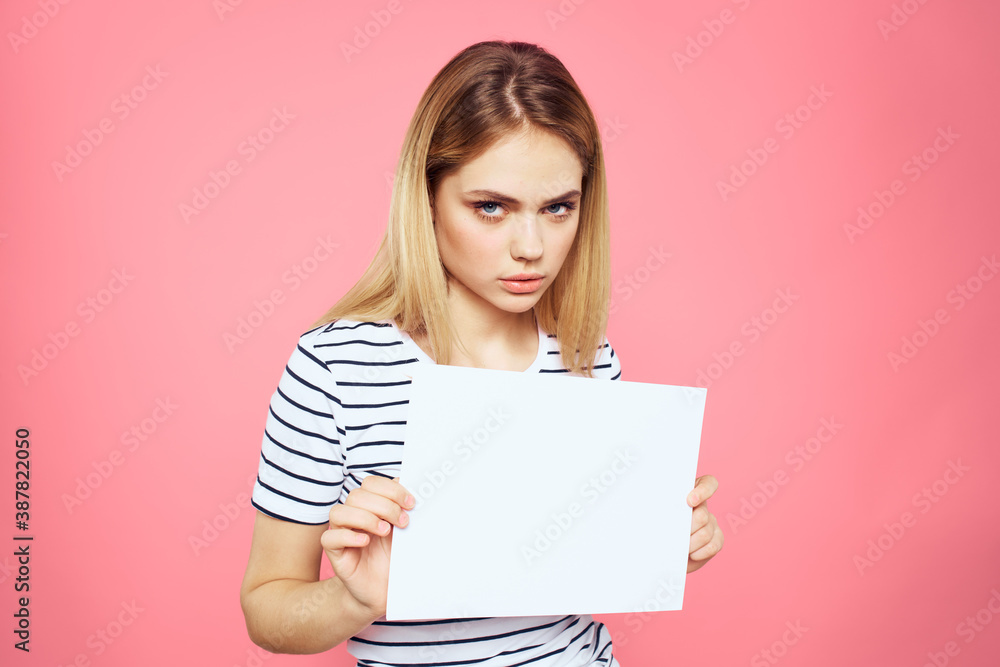 woman holding white sheet in her hands striped t-shirt emotions pink background woman holding white sheet in her hands striped t-shirt emotions pink background