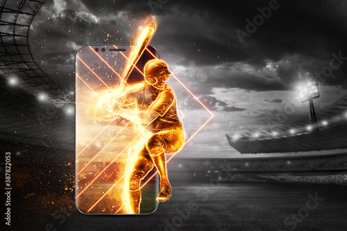 Photography A silhouette, an image of a baseball player with a bat on fire crawls out of a smartphone, a hologram