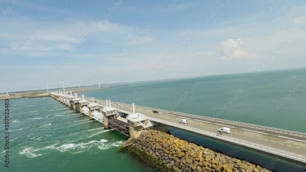 Drone shot of pebble waterside and stunning storm surge barrier on sunny north sea in neeltje jans. Drone shot of pebble waterside and stunning storm surge barrier on sunny north sea in neeltje jans.