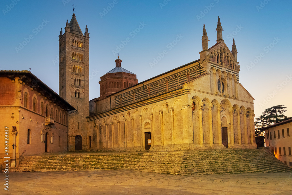 Fototapeta premium View of the Cathedral of Saint Cerbonius with Bell tower at the Garibaldi place in Massa Marittima, taken at night Maremma, Tuscany - Italy