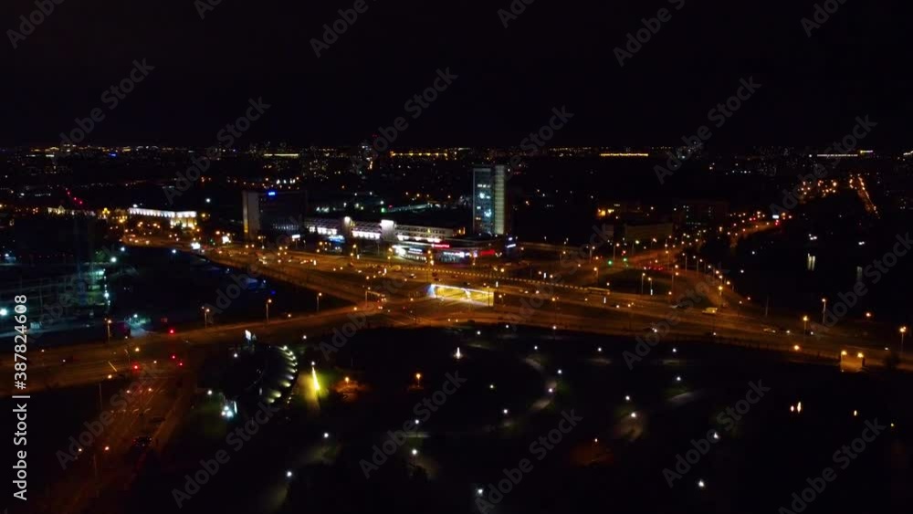 Smooth slow descent over the city at night with illumination Smooth slow descent over the city at night with illumination