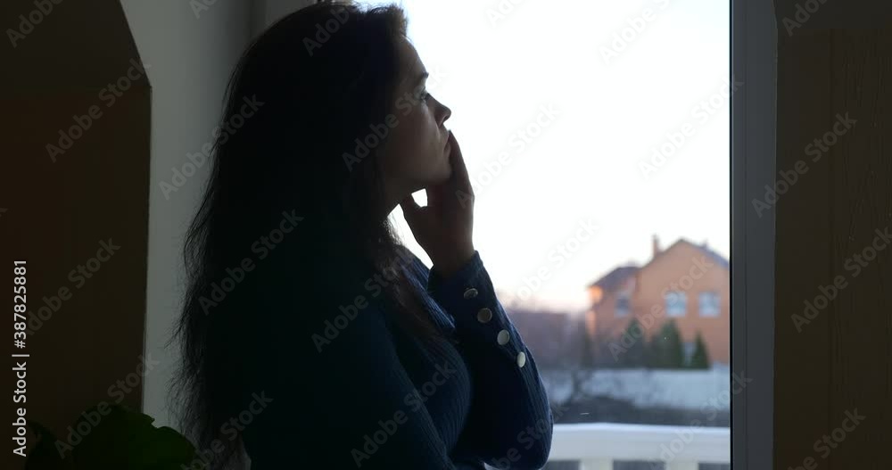 Distressed Woman Thinks Calms Down Relax after Stress Standing Near Window. Sad Emotions Distressed Woman Thinks Calms Down Relax after Stress Standing Near Window. Sad Emotions