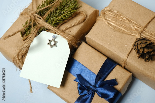 Jewish holiday Hanukkah background. Hanukkah celebration with gift box. Happy Hanukkah 2021. Space for text and felicitation.