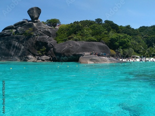 Gorgeous view of Similan islands with turquoise water and light blue sky.