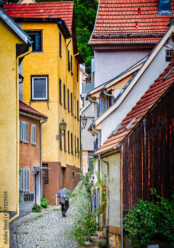 Fototapeta Naklejka Na Ścianę i Meble -  Unidentified man walks up cobbled street in Esslingen-