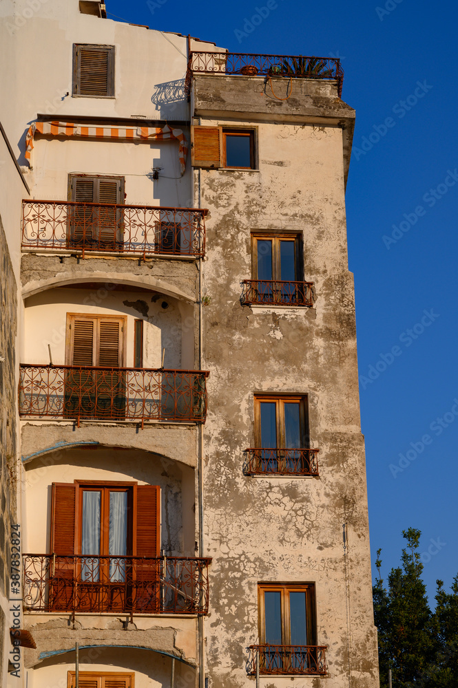 View on old houses of medieval small touristic coastal town Sperlonga and sea shore, Latina, Italy on sunrise