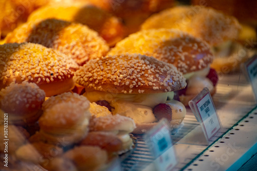 French fresh baked sweet filled brioche pastry tarte tropezienne in confectionery shop in Saint-Tropez, Provence, France photo