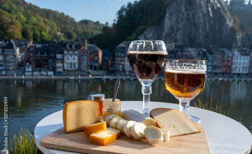 Photos Glass of Belgian abbey beer and tasting of cheeses made with trappist beer and f