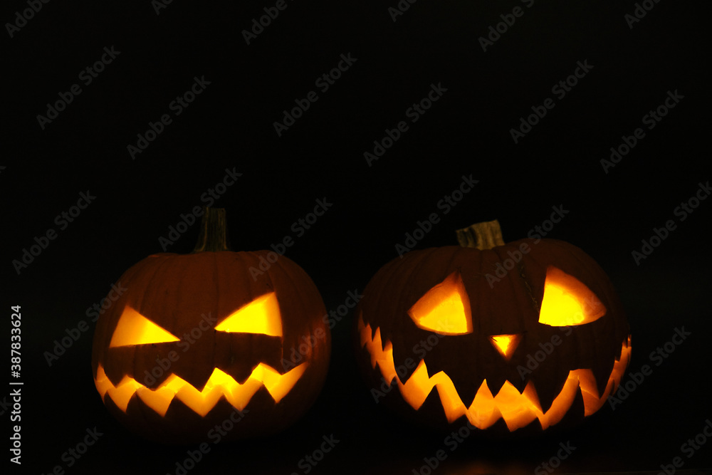 Glowing Halloween Pumpkins isolated on black background