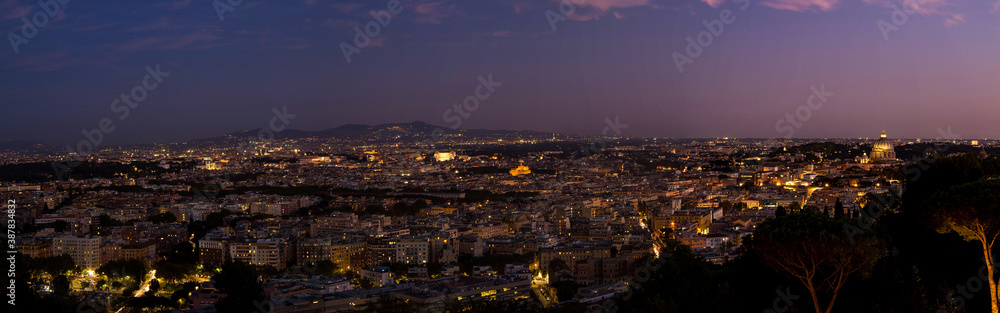 panoramic view of Rome from Monte Mario hill at dusk with the Roman castles in the background