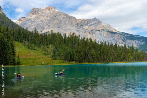 2 canoes at Emerald lake against a forest and mountain 