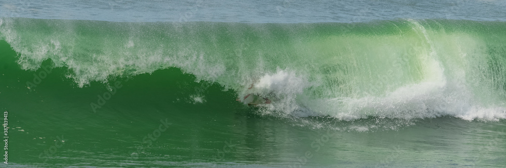 Surfer in a big wave, Anglet in the pays basque, France Surfer in a big wave, Anglet in the pays basque, France