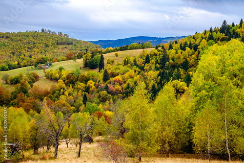 Colorful autumn landscape in the Romanian Carpathians, Fantanele village, Sibiu county, Cindrel mountains, 1100m, Romania photo