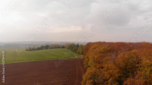 Beautiffull Autumn drone fly over the trees and fields photo