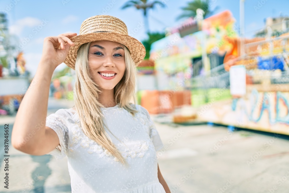 Young caucasian tourist girl smiling happy walking at fairground.