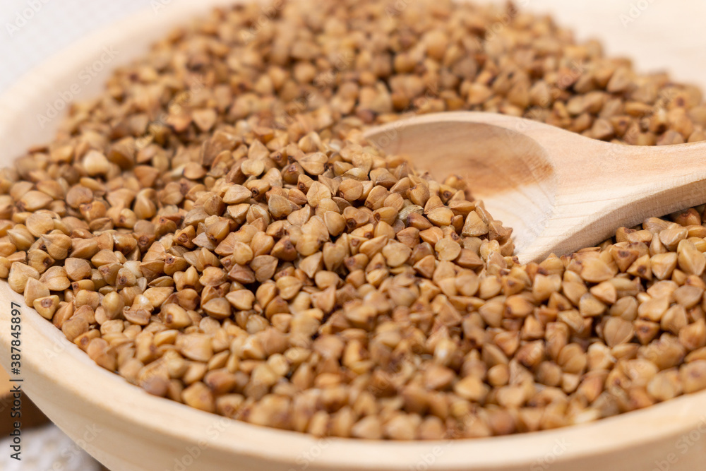 Buckwheat grain dry buckwheat. Close-up of brown buckwheat groats. Healthy food. Buckwheat grain dry buckwheat. Close-up of brown buckwheat groats. Healthy food.