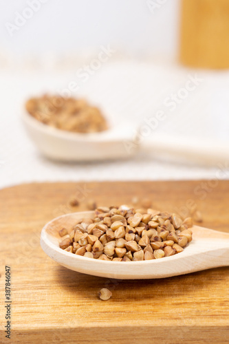 buckwheat macro view on rustic background. gluten free ancient grain for healthy diet. vertical photo