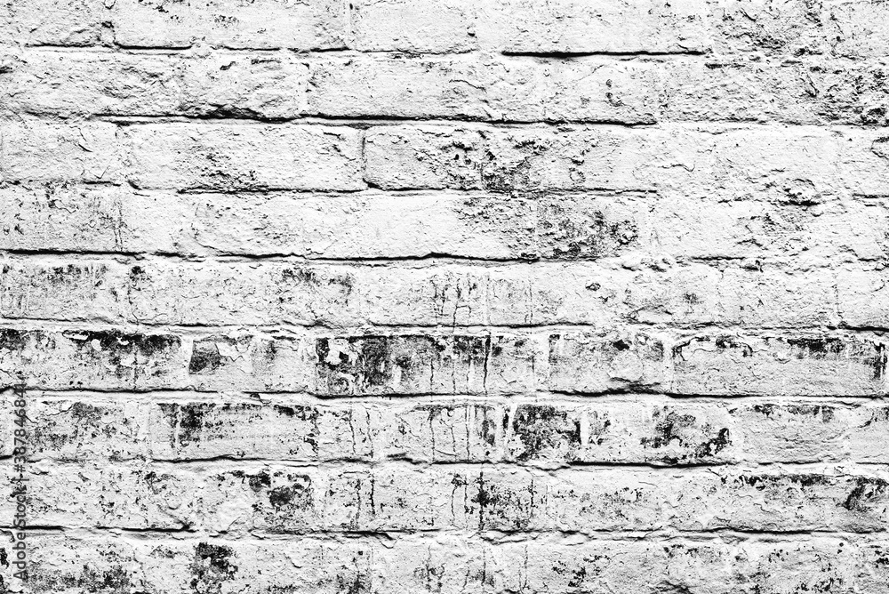 Texture of a brick wall with cracks and scratches which can be used as a background