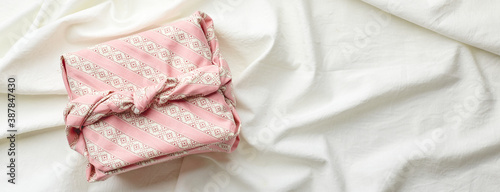 Eco-friendly gift wrap in traditional japanese furoshiki style, eco-friendly gift wrap and Zero Wast concept photo