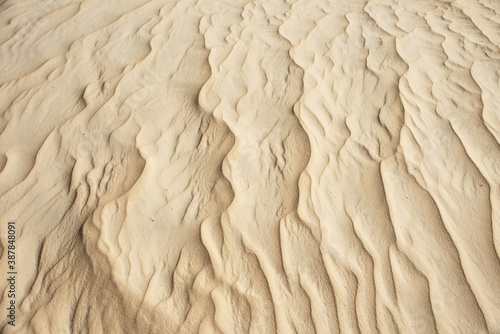 closeup of sand pattern of a beach in the summer, Background, texture. design