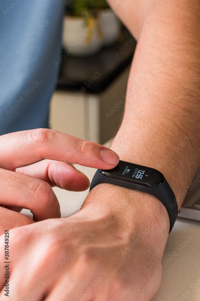 Fototapeta premium watching the time on a smart band.
