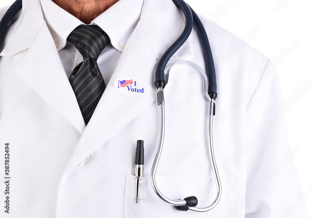 Closeup of a doctor with an I Voted sticker on the lapel of his white Lab Coat. Closeup of a doctor with an I Voted sticker on the lapel of his white Lab Coat.
