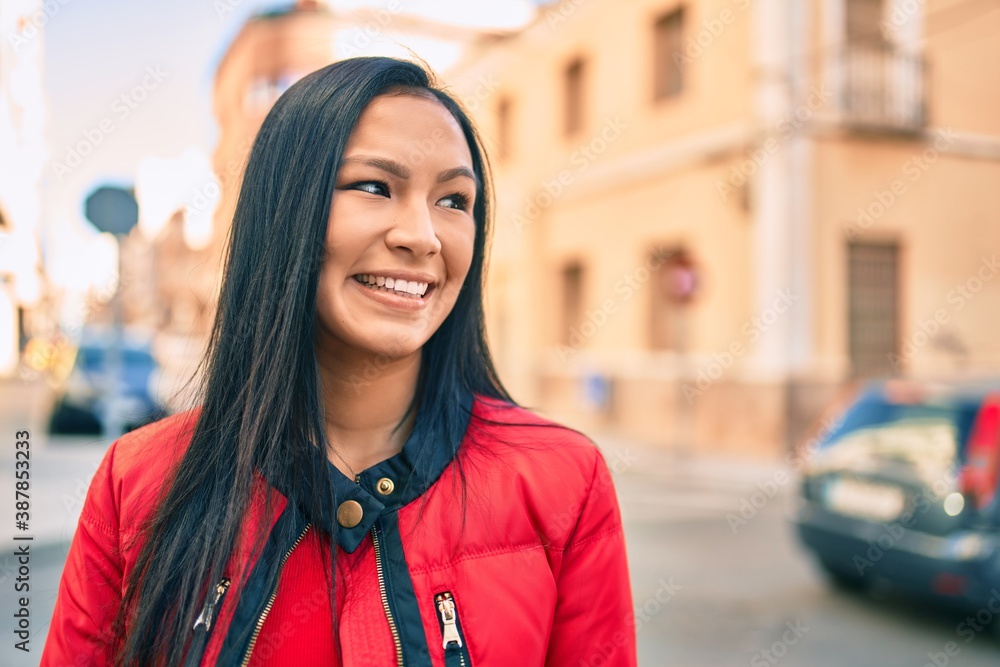 Young latin woman smiling happy walking at the city. Young latin woman smiling happy walking at the city.