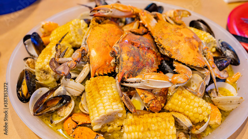 Close up shot of fresh steamed crab, corn, mussel, shrimp