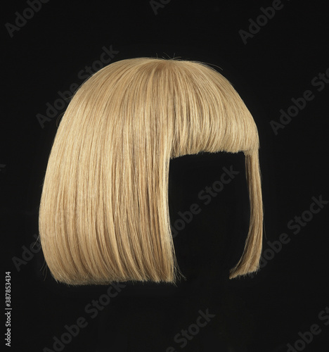 Blonde hair wig with bob cut, black background