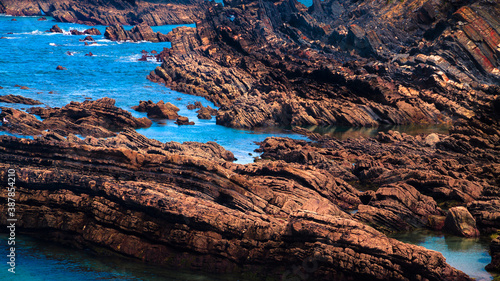 rocky coast of the sea with rocks surrounded by water