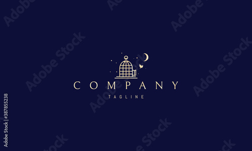 Vector golden logo on which an abstract image of a bird freed from a cage on a background of stars.