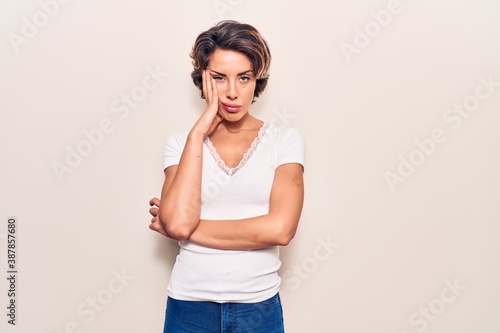 Young beautiful woman wearing casual clothes thinking looking tired and bored with depression problems with crossed arms.
