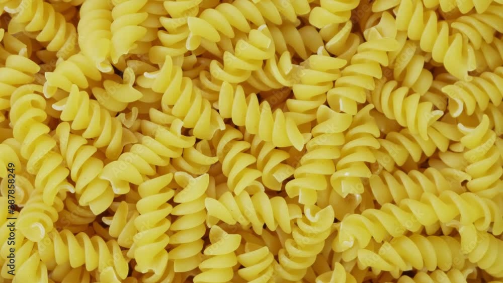 Closeup of Uncooked Italian Spiral Pasta, Slow rotation Closeup of Uncooked Italian Spiral Pasta, Slow rotation