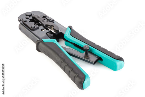 Modular crimper for RJ-45 and RJ-11 isolated on white background. internet or telephone line cables and crimper. Crimping connector RJ45 and LAN cable. Full depth of field. Close-up