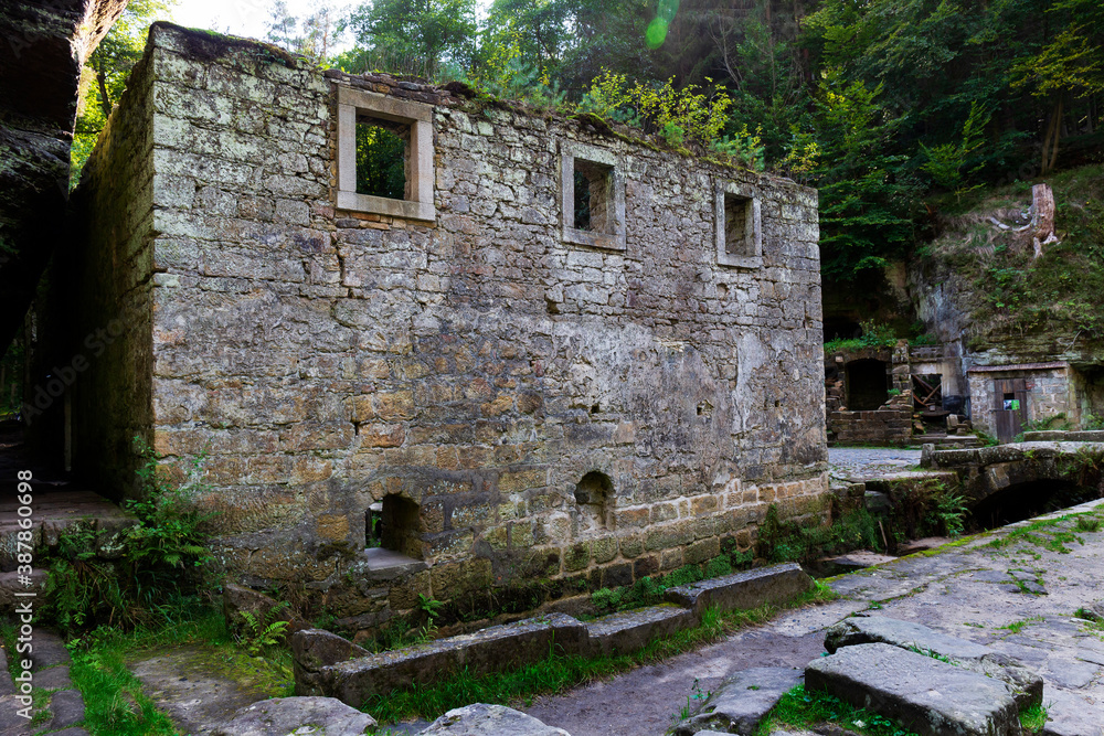 Ruin of Dolsky Mill from 18th century on the River Kamenice in Bohemian Switzerland, Czech Republic