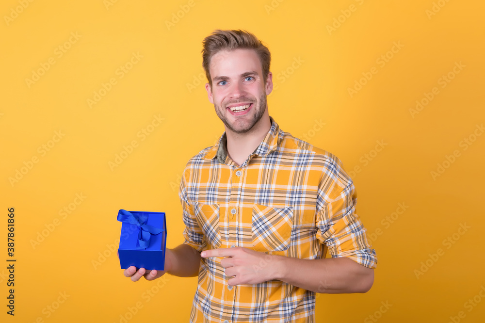 try this one. sale and discount concept. boxing day. happy birthday to you. surprise for holiday. handsome unshaven man hold present box. young macho with valentines day gift. male go shopping try this one. sale and discount concept. boxing day. happy birthday to you. surprise for holiday. handsome unshaven man hold present box. young macho with valentines day gift. male go shopping