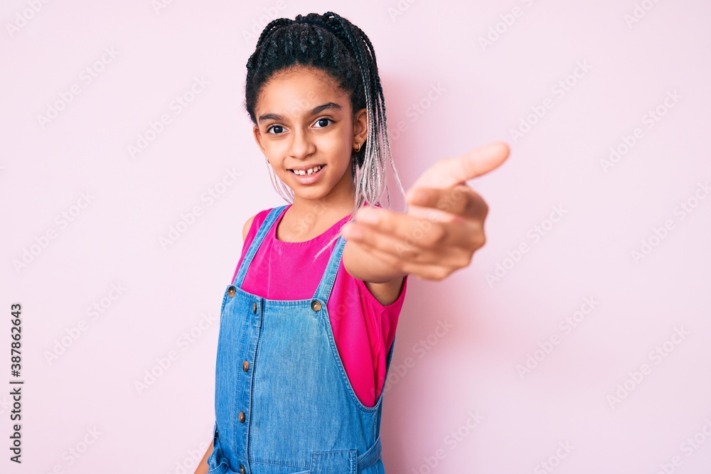 Young african american girl child with braids wearing casual clothes