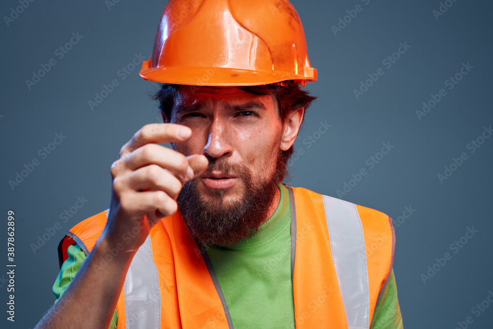 Man in orange construction work cropped view Man in orange construction work cropped view