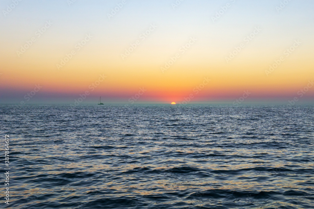 Sunset sea horizon ship silhouette landscape. Marine nature sun