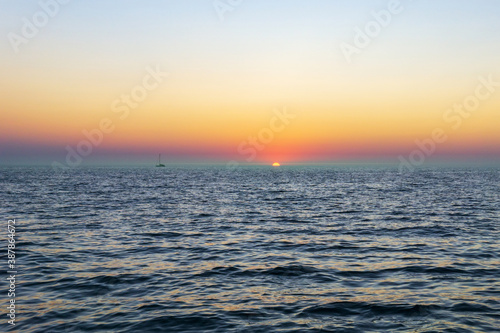 Sunset sea horizon ship silhouette landscape. Marine nature sun