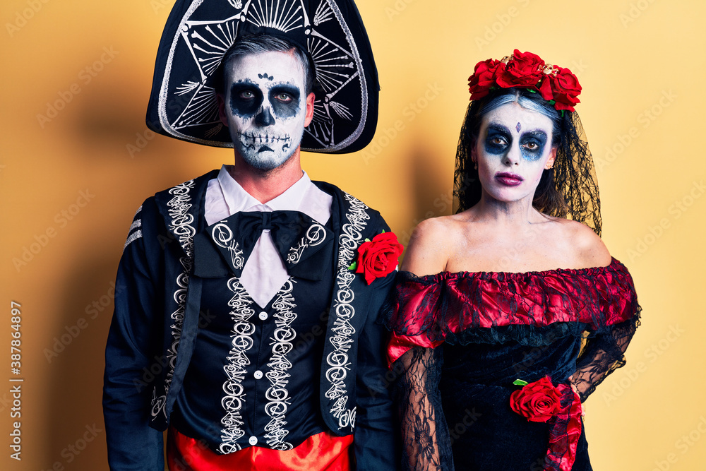 Young couple wearing mexican day of the dead costume over yellow looking  sleepy and tired, exhausted for fatigue and hangover, lazy eyes in the  morning. Stock Photo | Adobe Stock