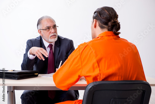 Canvas Print Young captive meeting with advocate in pre-trial detention