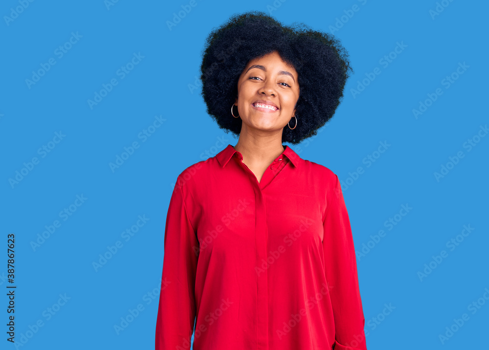 Young african american girl wearing casual clothes with a happy and cool smile on face. lucky person. Young african american girl wearing casual clothes with a happy and cool smile on face. lucky person.