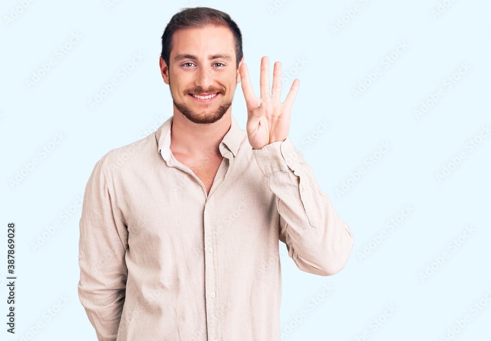 Young handsome caucasian man wearing casual clothes showing and pointing up with fingers number four while smiling confident and happy. Young handsome caucasian man wearing casual clothes showing and pointing up with fingers number four while smiling confident and happy.