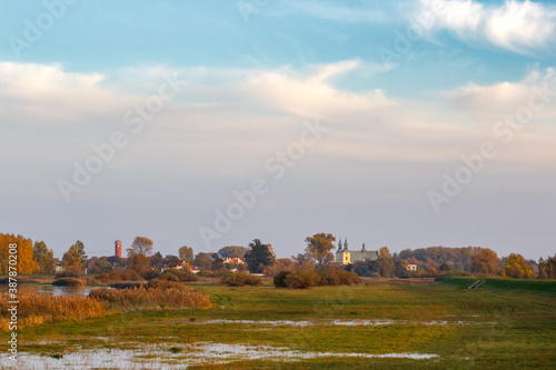 Panorama of the city of Kolo - monastery and town hall from the side of the Warta River - Poland