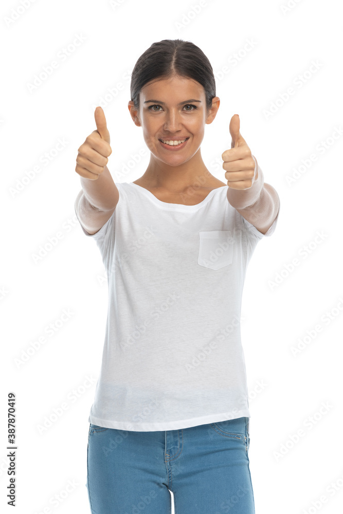 Happy casual woman smiling and gesturing ok with both hands Happy casual woman smiling and gesturing ok with both hands
