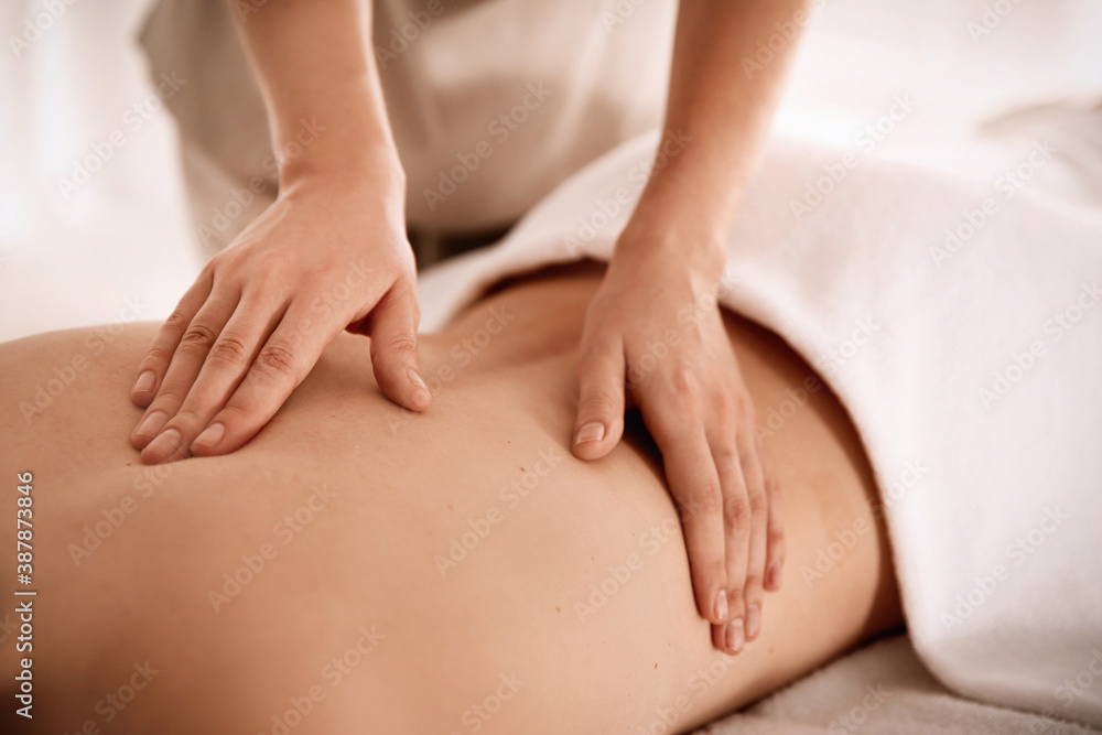 Young woman receiving back massage in spa salon, closeup Young woman receiving back massage in spa salon, closeup